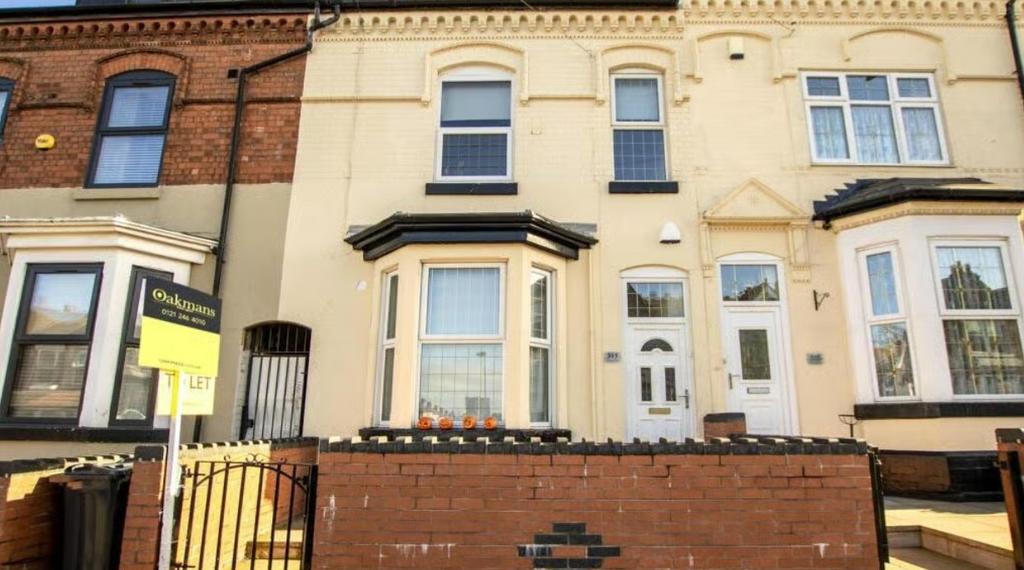 A charming terraced house exterior featuring a ...