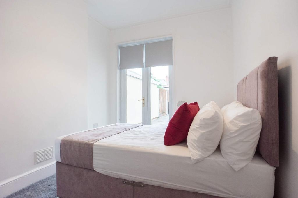 A neat and cozy bedroom with a plush single bed...