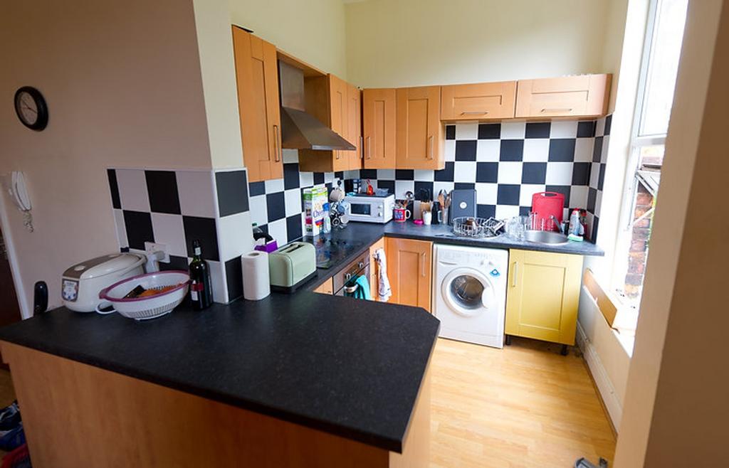 Bright and functional kitchen with modern appli...
