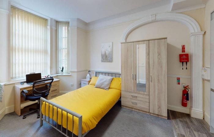 Bright and inviting single bedroom featuring a ...