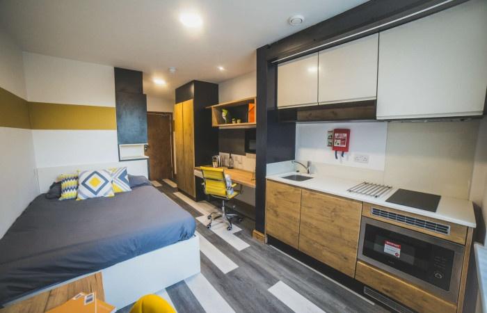 Bright and modern student studio featuring a co...