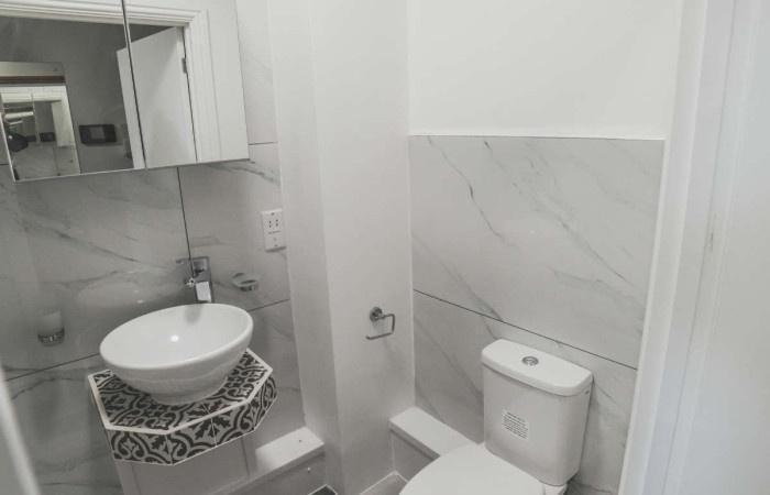 A modern and clean single toilet with stylish m...