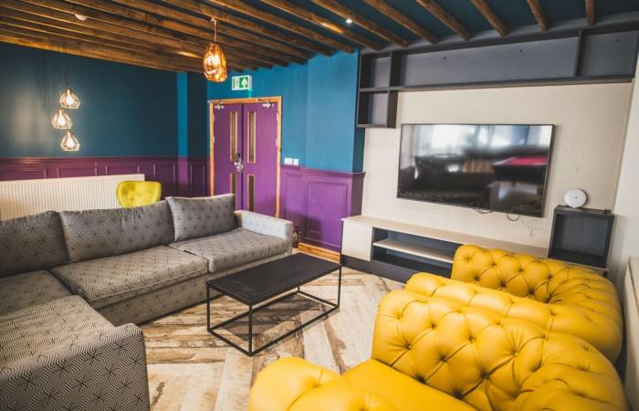A stylish communal lounge featuring comfortable...