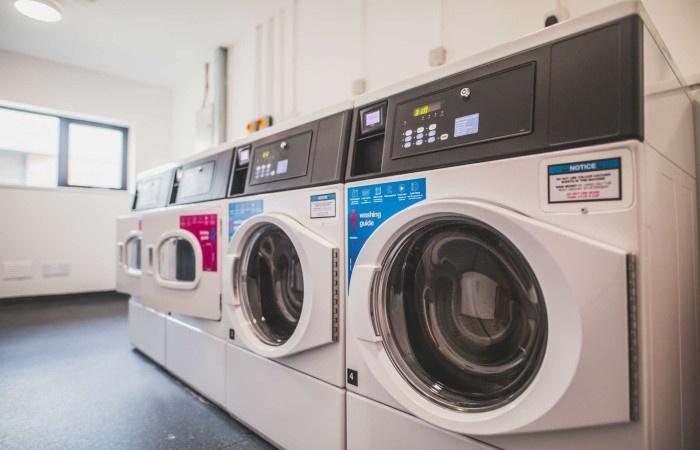 Bright and clean laundry room featuring modern ...