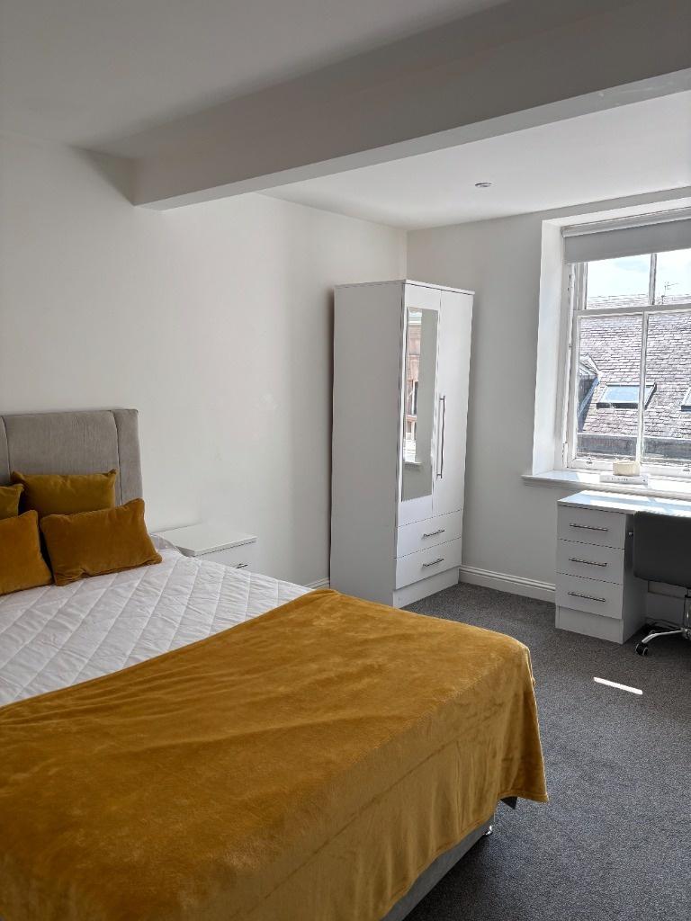 Bright and inviting master bedroom featuring a ...
