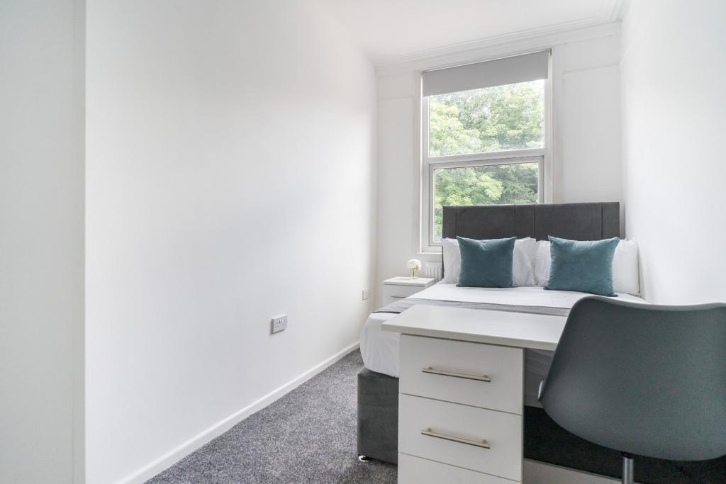 Bright and inviting double bedroom featuring a ...