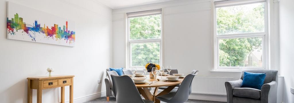 Bright and inviting living room featuring large...