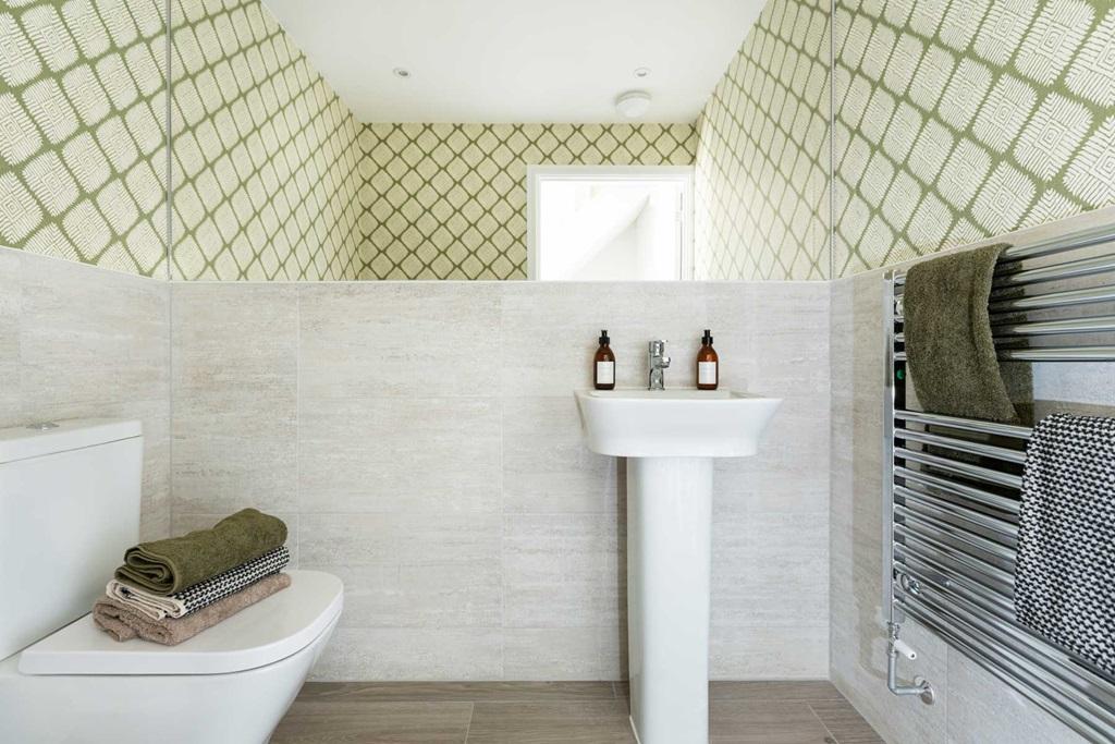 The downstairs toilet sits off the hallway