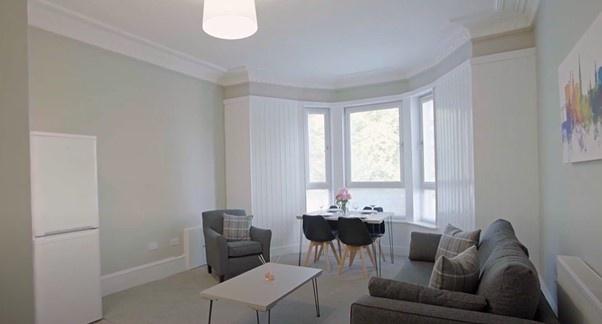 Bright and comfortable living room featuring a ...