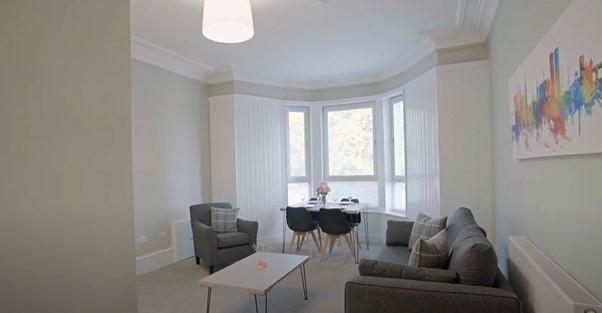 Bright and inviting living room featuring a com...