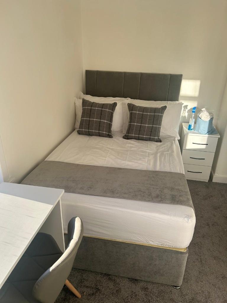 A bright and inviting double bedroom featuring ...