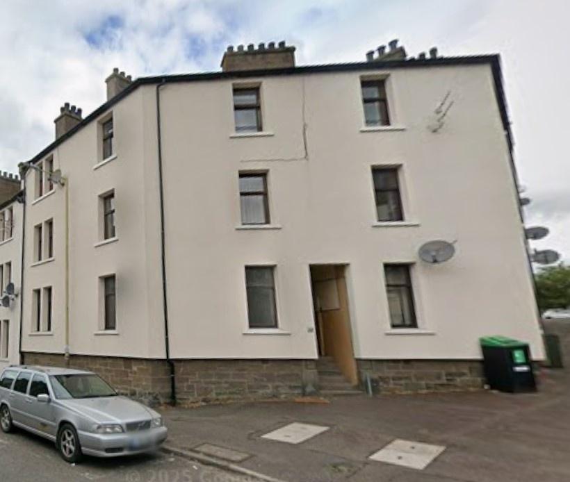 Well-maintained corner townhouse with pale exte...