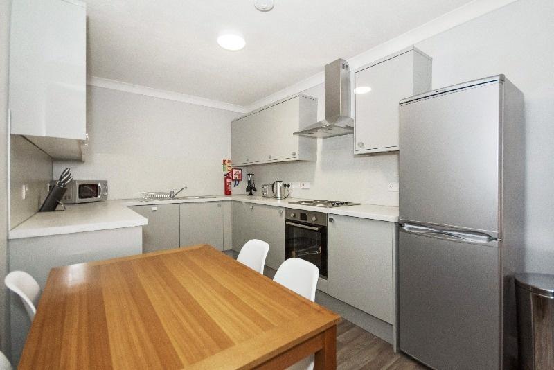 Modern kitchen equipped with sleek appliances a...