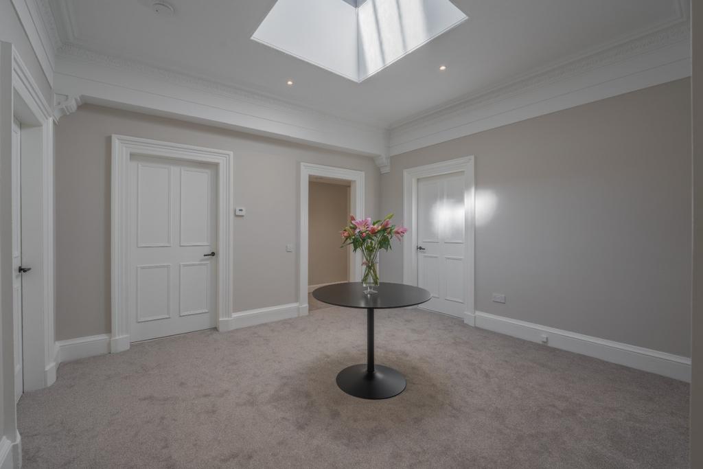 A bright and welcoming hallway featuring elegan...
