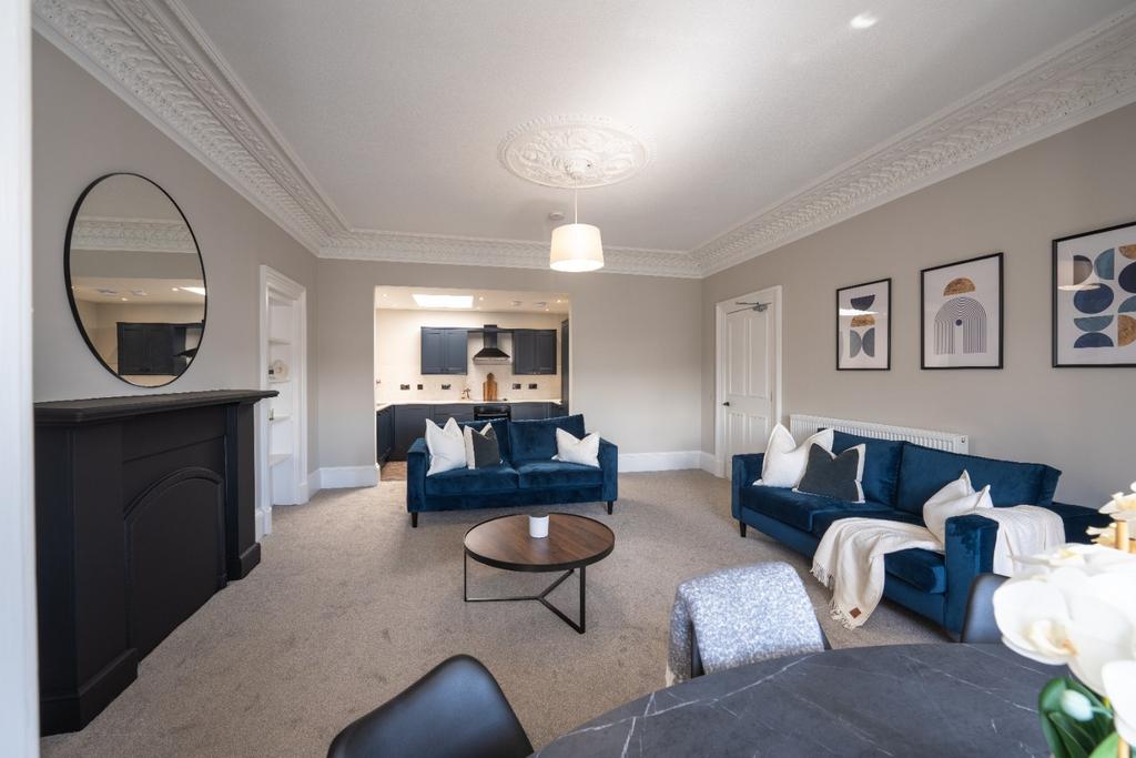 This contemporary living room features elegant ...