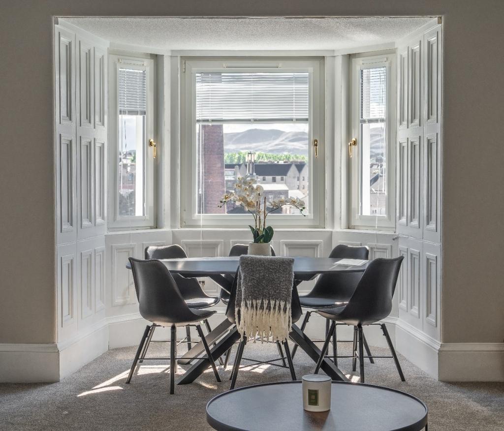 Bright and inviting living room featuring a sty...