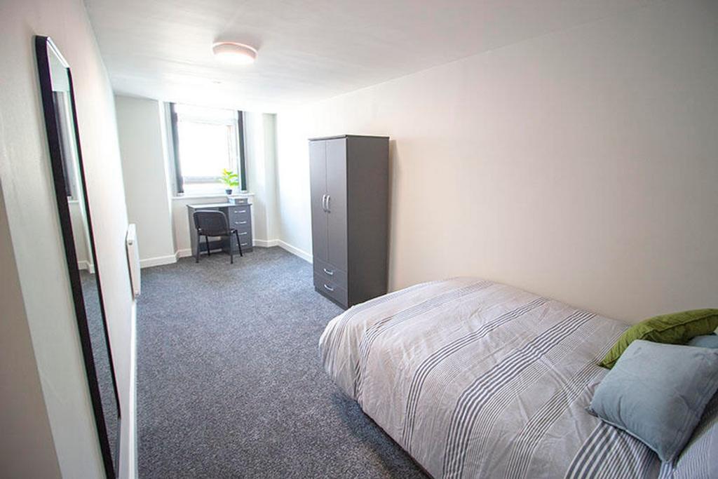 A spacious double bedroom featuring modern deco...