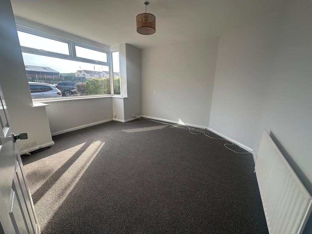 Bright and airy double bedroom featuring a larg...