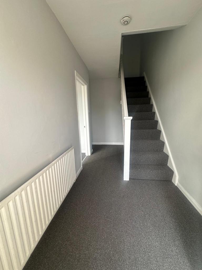 A clean and well-maintained hallway featuring n...
