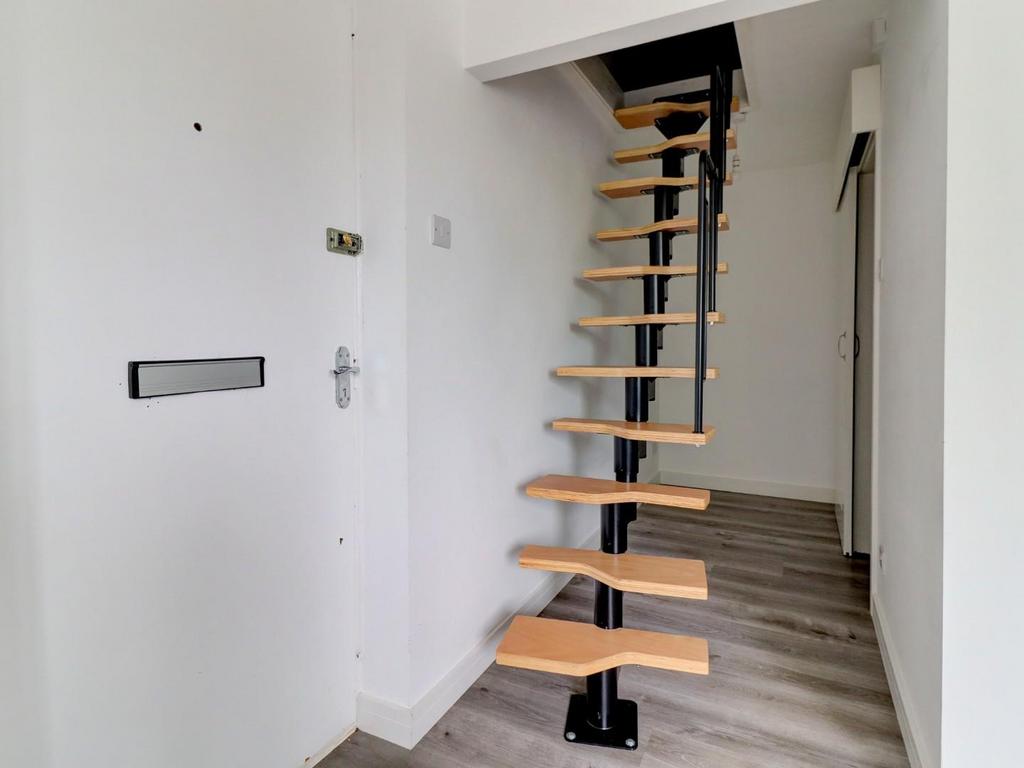 Stairs rising to Loft Room