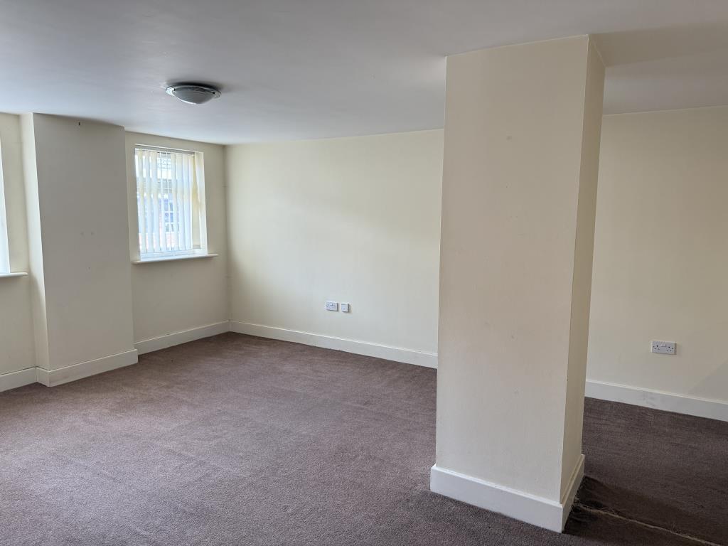 Vacant Flat B living room with painted walls and c