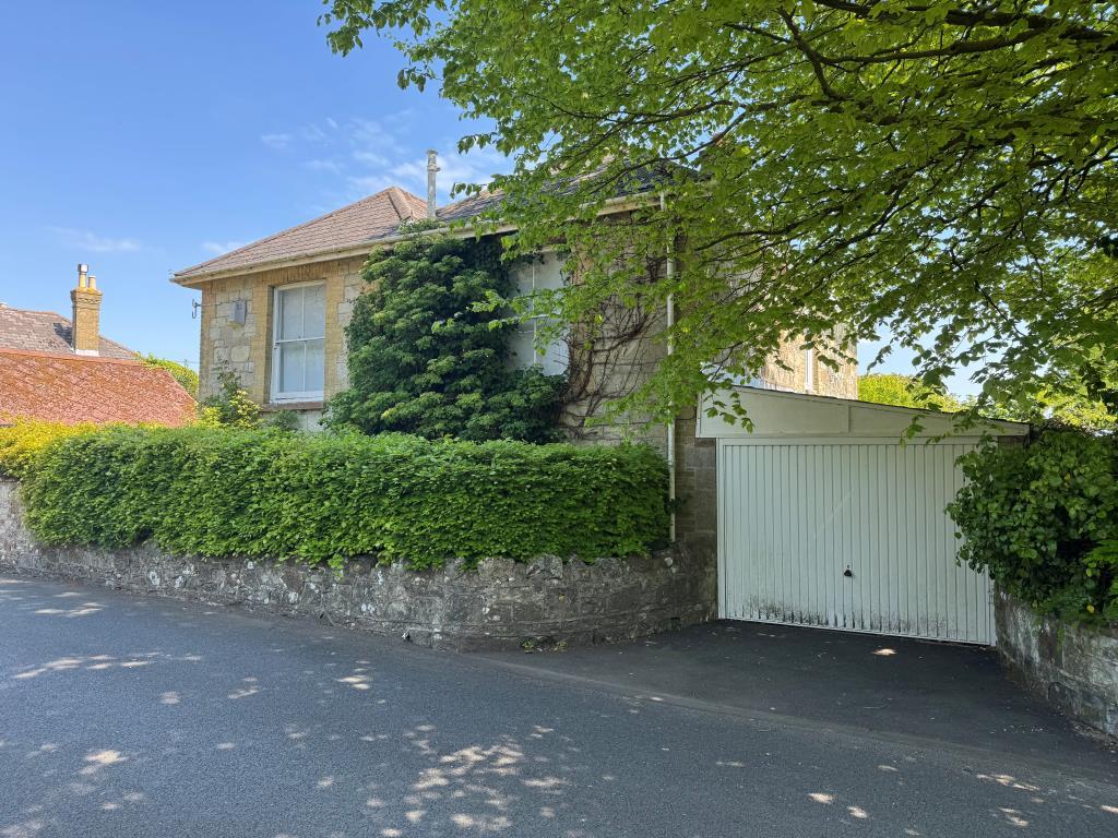 The House and garage from the street