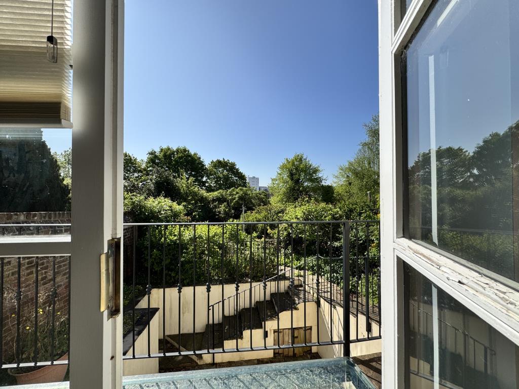 Balcony looking out to the rear garden