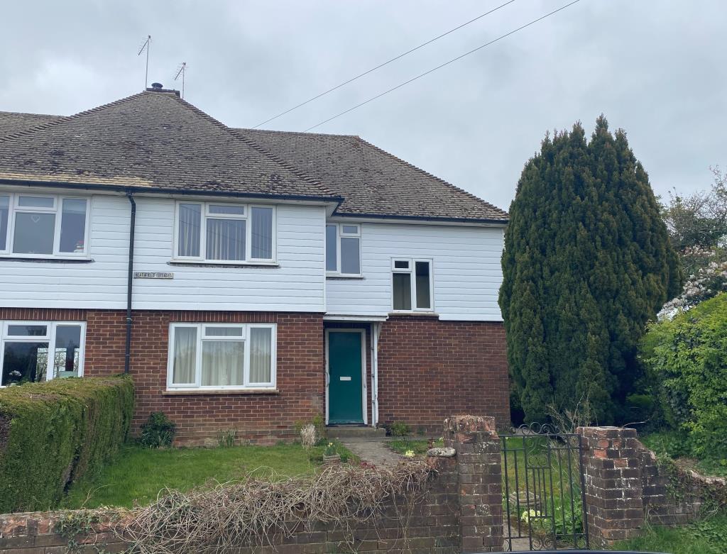 Front view of rural semi in need of modernisation