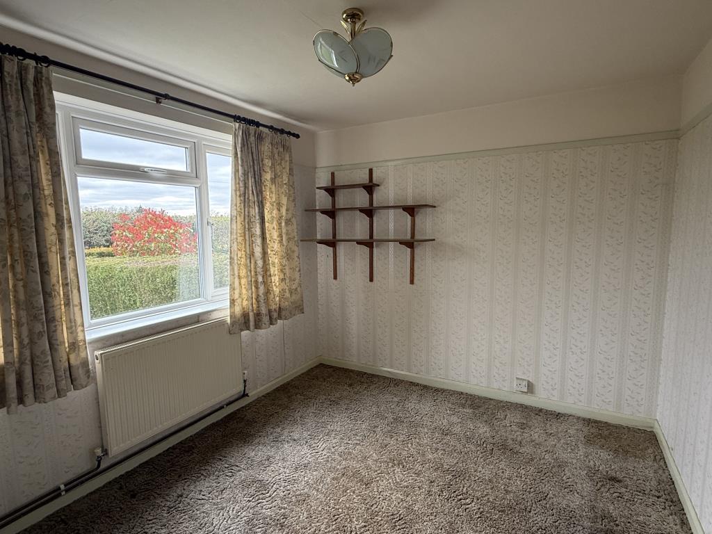 Living room in rural semi in need of modernisation