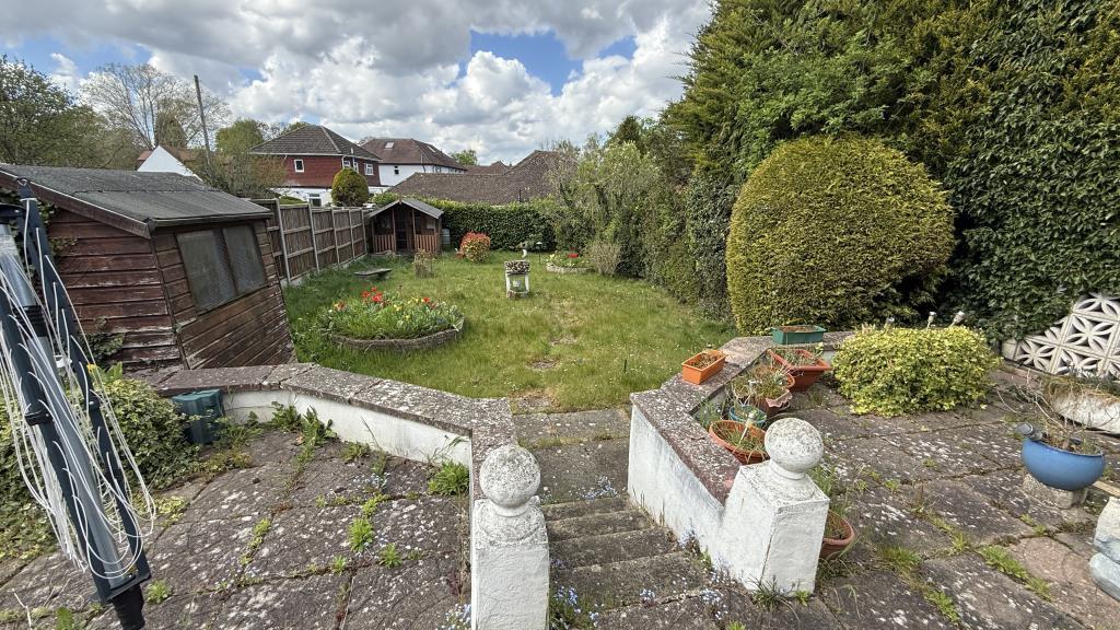 Exterior image of rear garden from bungalow patio