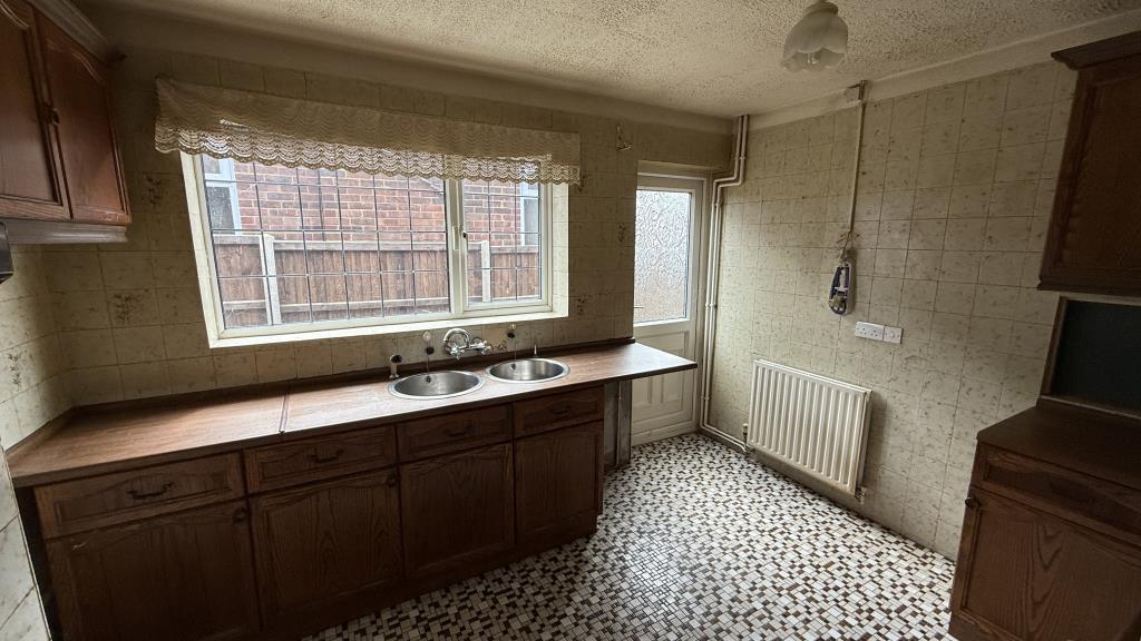 Interior image of kitchen from hallway