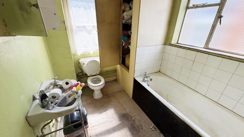 Interior image of first floor bathroom from rear b