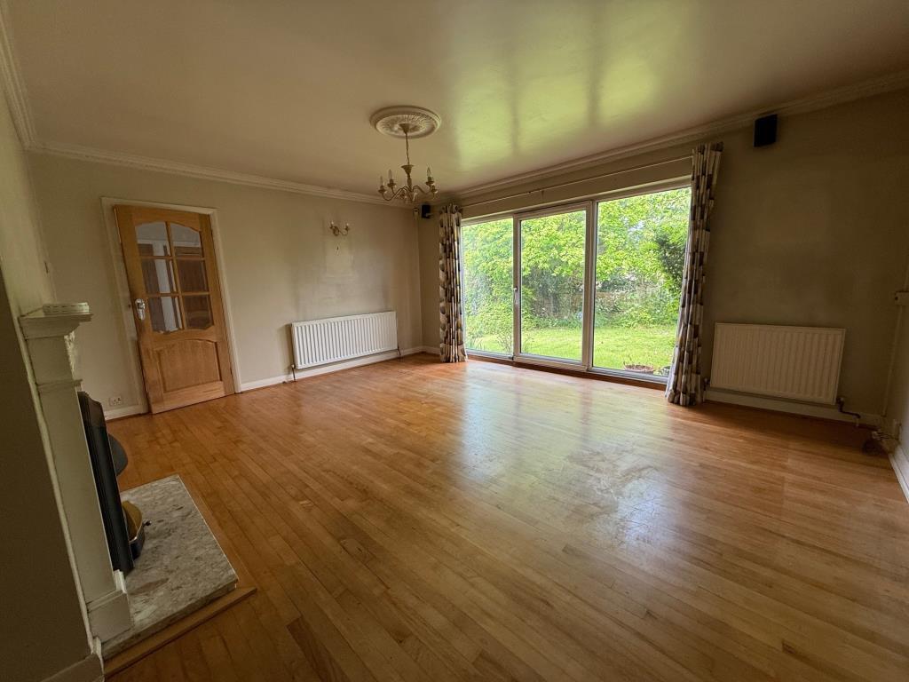 Reception room with access to hallway and front ga
