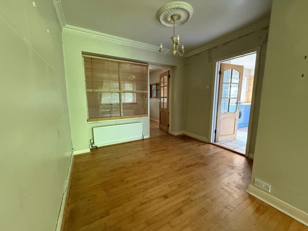 Reception area with access to kitchen and addition