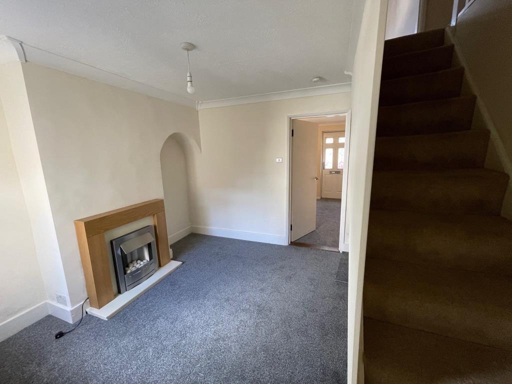 Dining room, with fireplace, window to rear and st