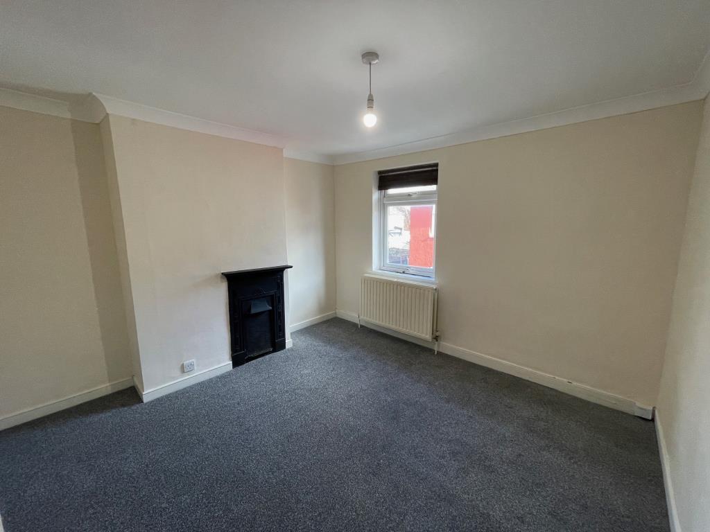 Bedroom 1 with window to front and fireplace
