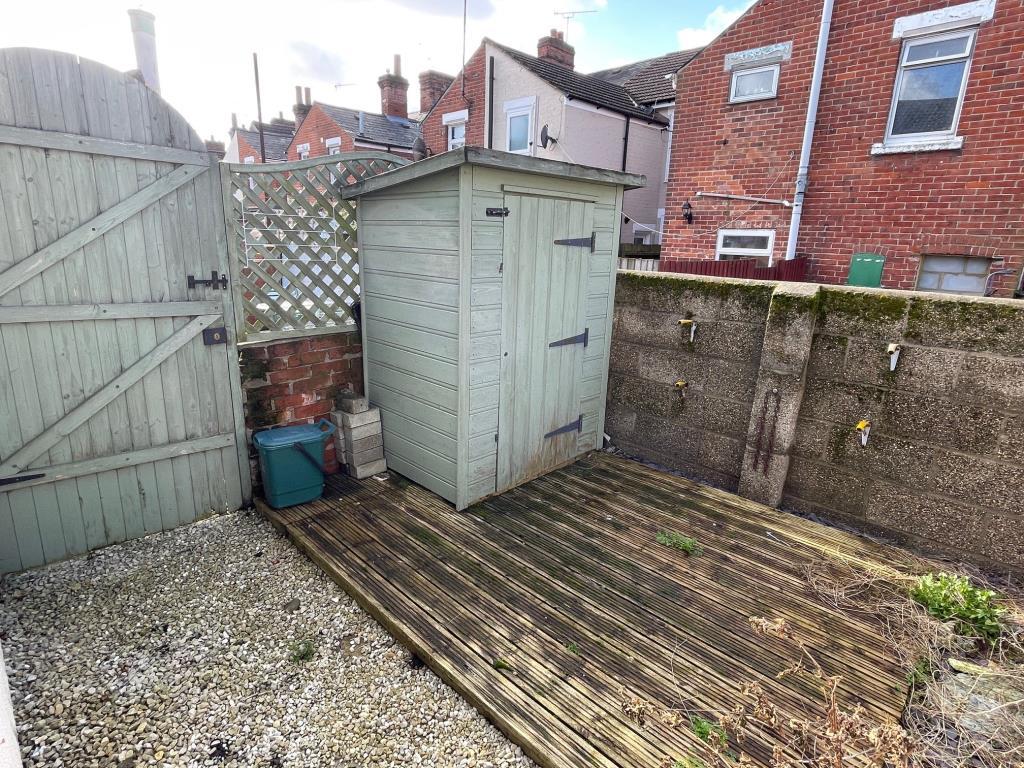 Rear yard with decking area, shed and bin access g