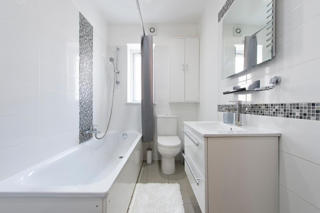 A spacious and well-maintained large bathroom f...