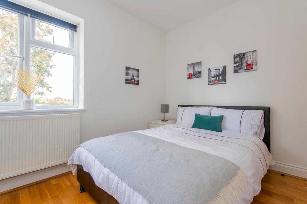 A spacious and bright double bedroom featuring ...