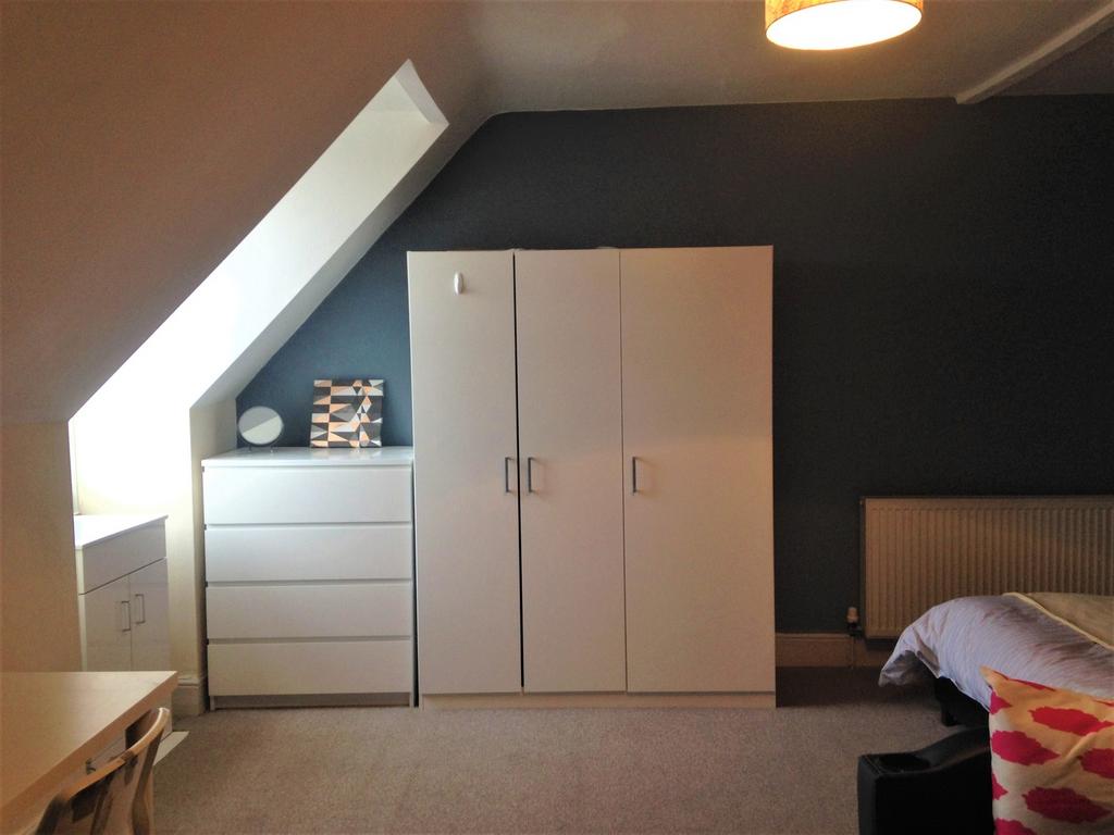Spacious double bedroom with ample storage and ...