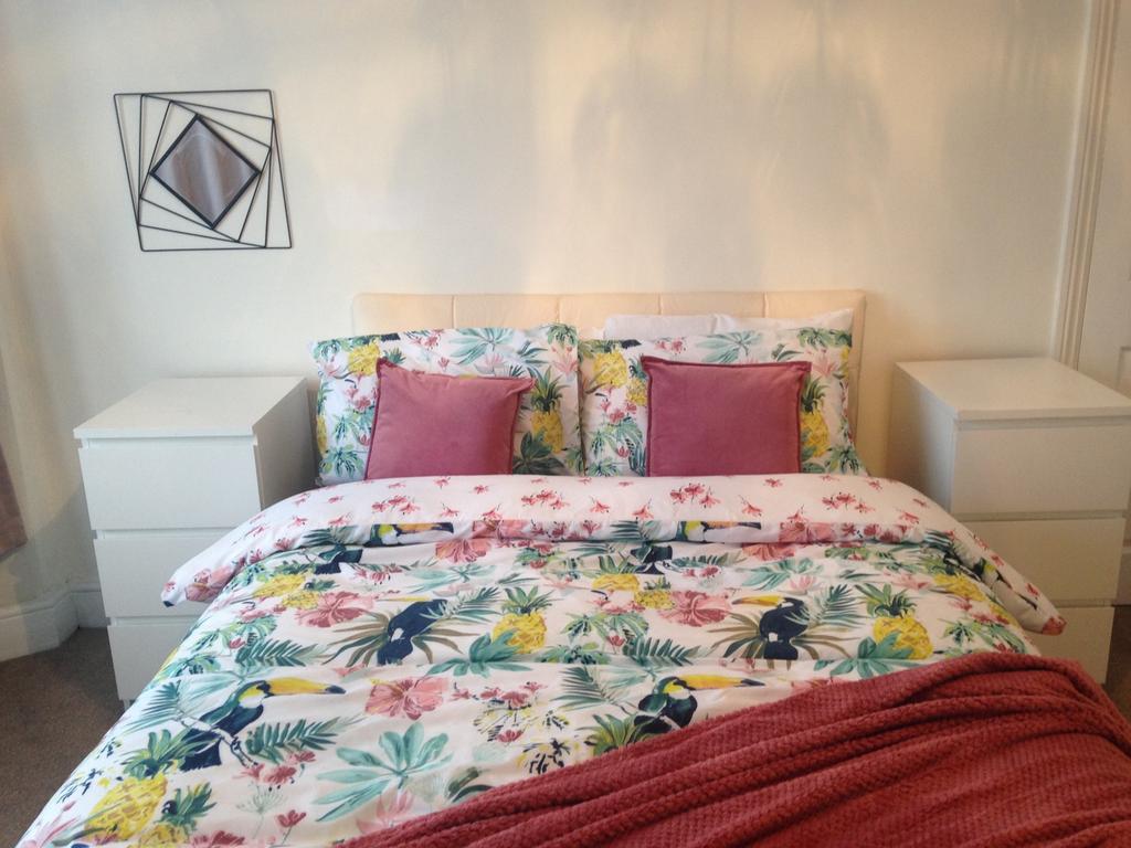 A beautifully decorated double bedroom featurin...