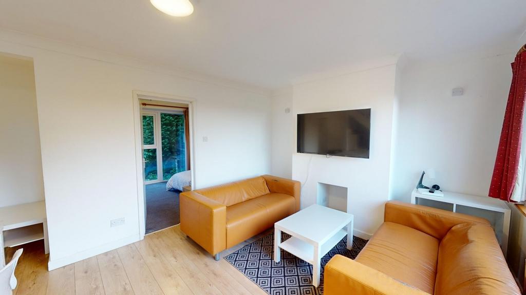 A bright and inviting large modern living room ...