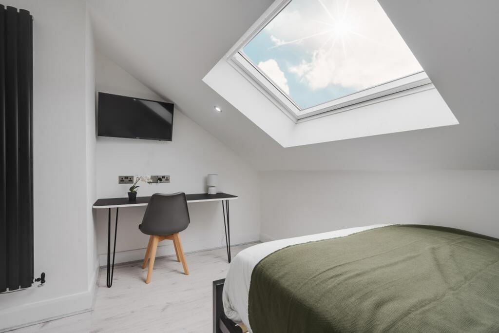 This inviting double bedroom features a comfort...