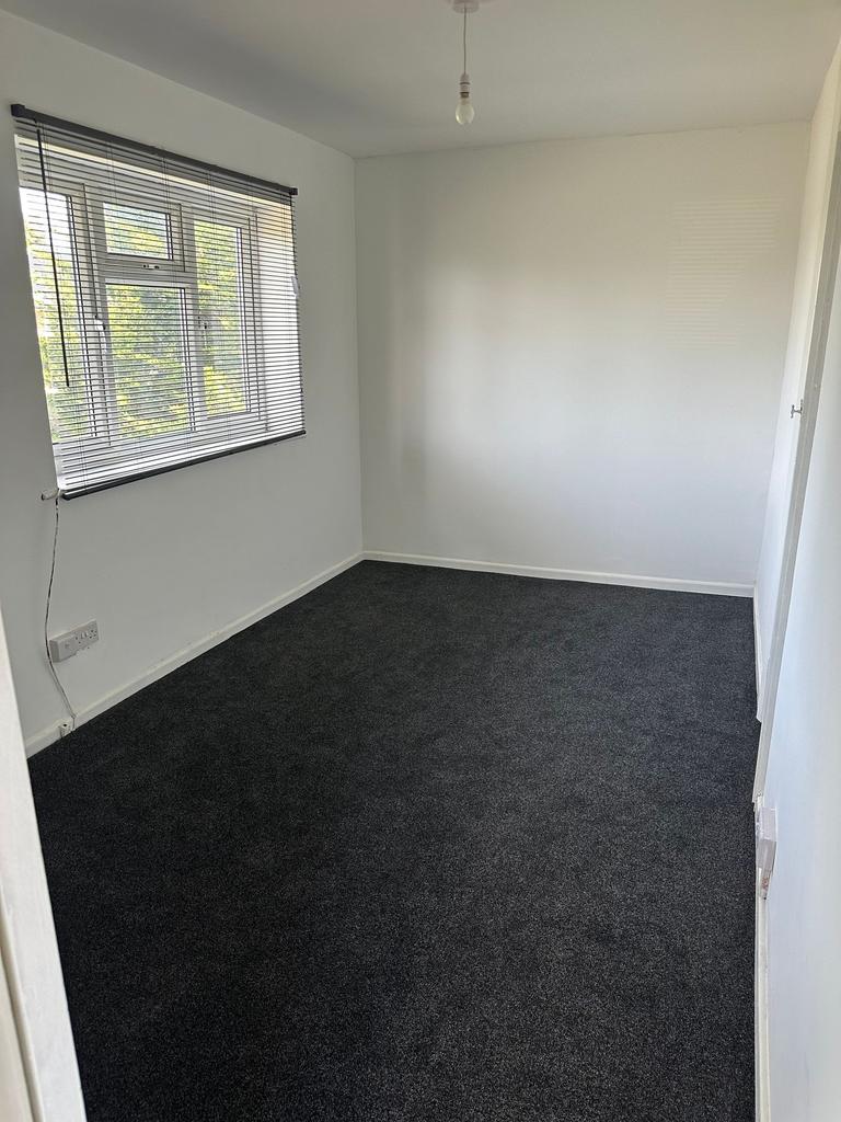 A neat and well-maintained single bedroom with ...