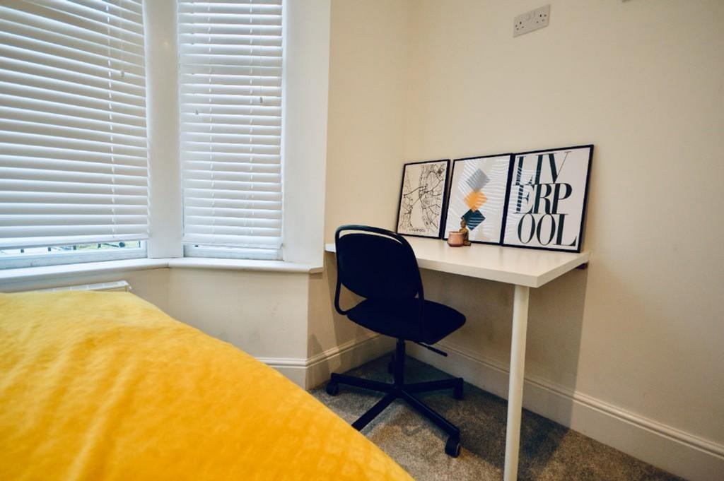 Bright and inviting double bedroom featuring a ...