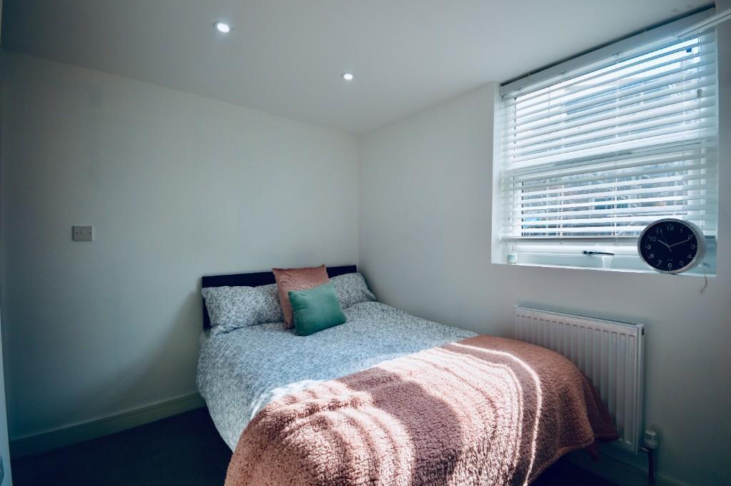A beautifully designed double bedroom featuring...