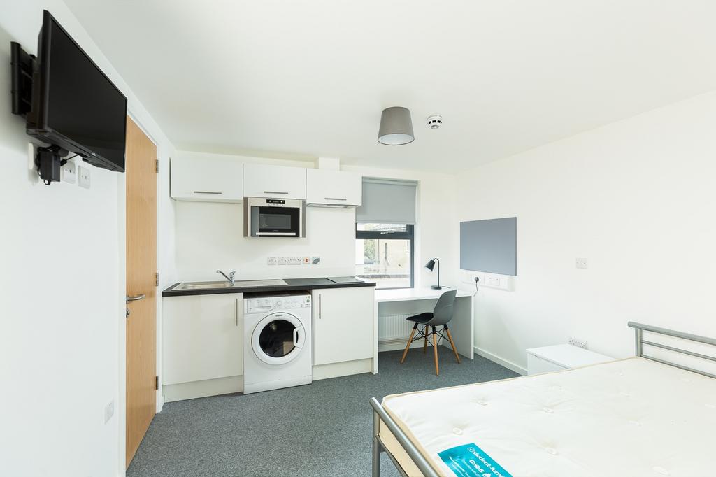 A bright and spacious double bedroom featuring ...
