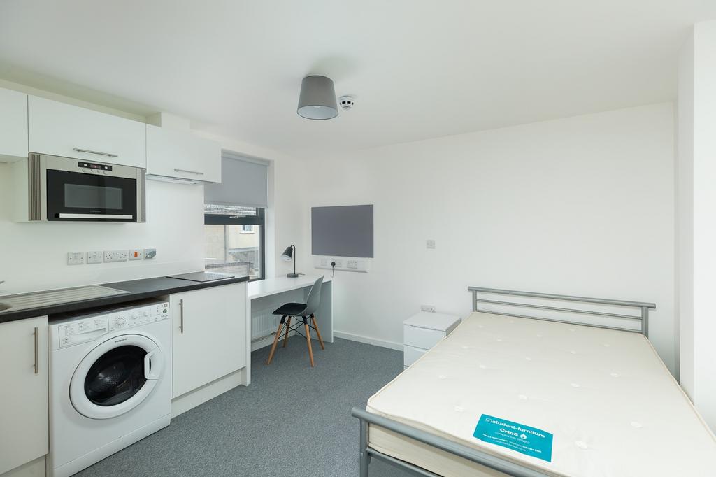A bright and spacious double bedroom featuring ...