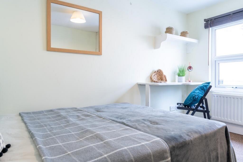 This inviting double bedroom features a cozy la...