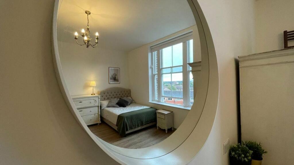 A bright and inviting double bedroom featuring ...
